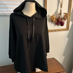 Black Hooded knit casual active wear with sparklyDrawstring. 3/4 length sleeves.